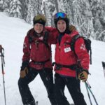 Dr. Carey skiing with a colleague