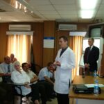 Dr. Carey presenting in a group setting in another different angle