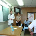 Dr. Carey presenting in a group setting in a different angle