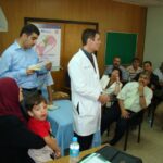 Dr. Carey presenting in a group setting with a child