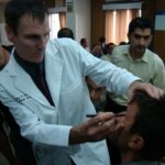 Dr. Carey working with a male patient